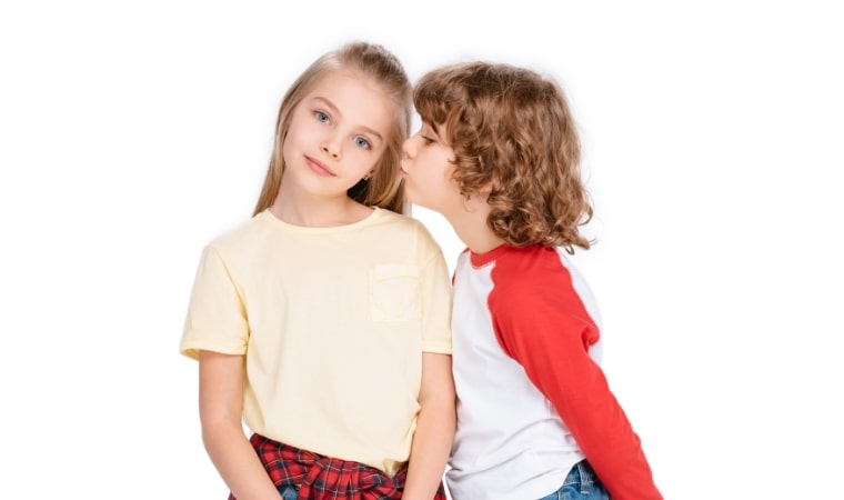 boy kissing girl on cheek, ready to read childrens books about growing up