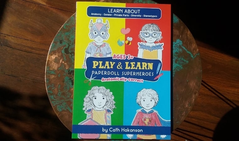 cover of play and learn paperdoll superheroes by cath hakanson