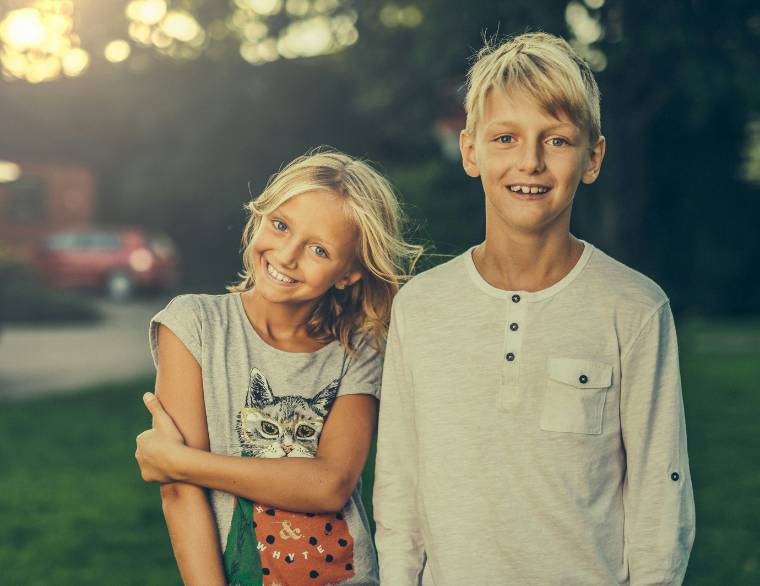 boy and girl standing next to each other, age suitable for the puberty talk