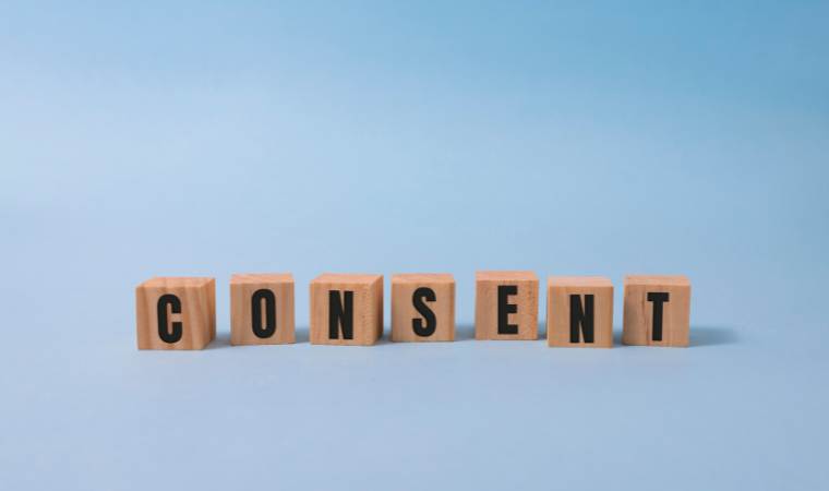 blocks spelling the word sensent, for a parent guide on teaching consent to children, tweens and teens