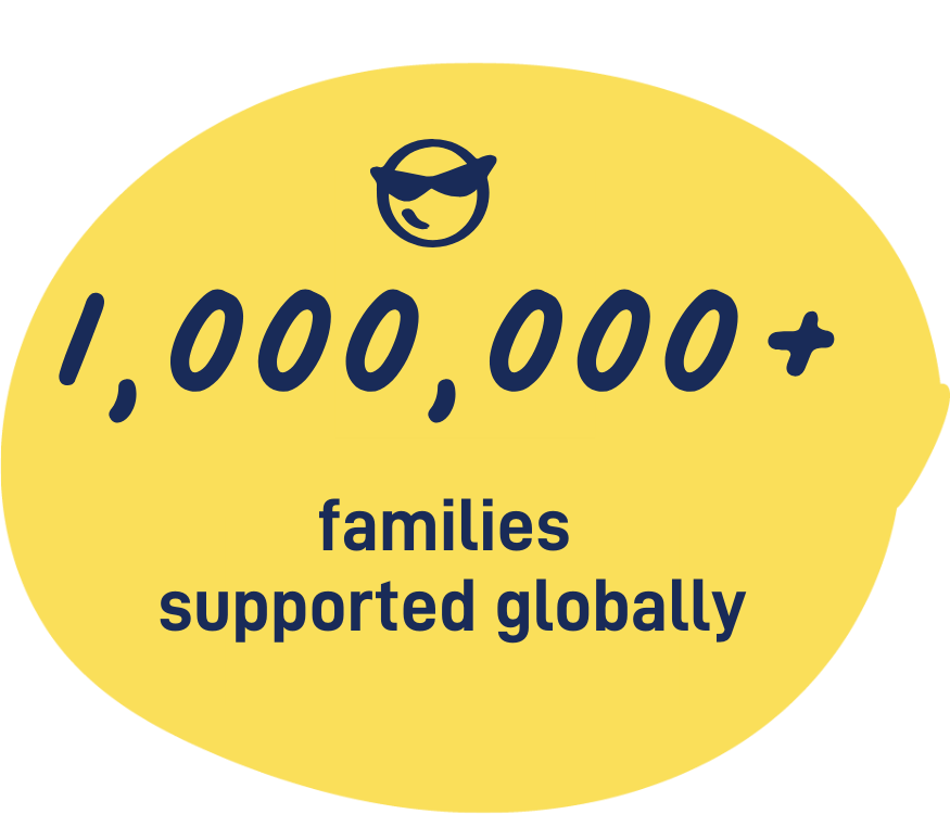 circle with words and a smiley face - 1,000,000+ families supported globally