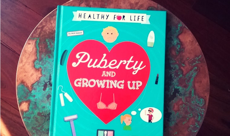 cover of Puberty and Growing Up by Anna Claybourne