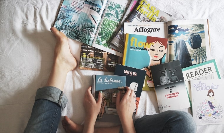 girl with magazines on her bed